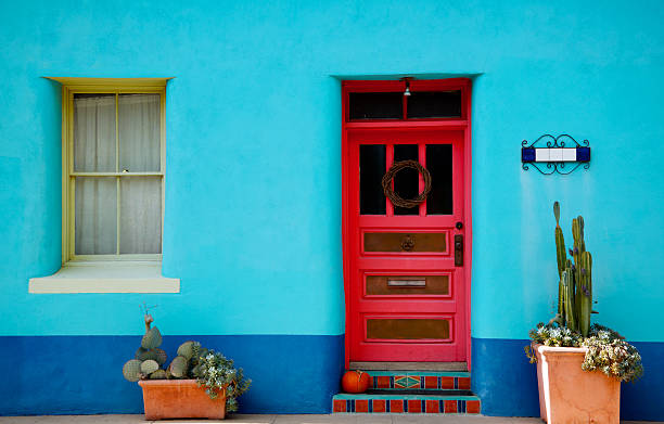 Arizona, Mexico Blue Stucco Wall and Red Door