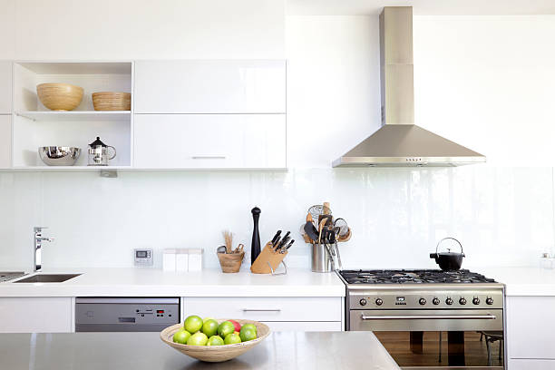 White kitchen Contemporary white and stainless steel new kitchen kitchen hood stock pictures, royalty-free photos & images