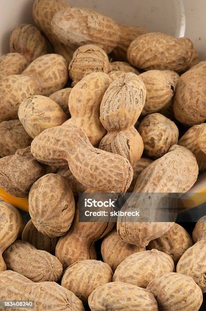 Roasted And Salted Peanuts Falling From A Bowl Stock Photo - Download Image Now - Bowl, Close-up, Food
