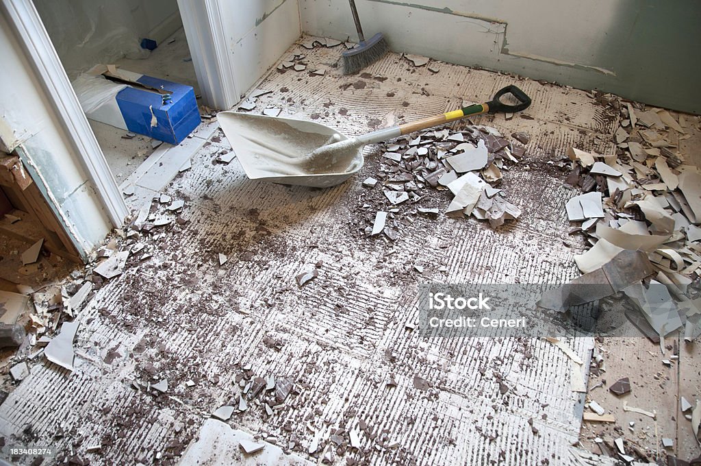 Home Improvement and Remodeling: Demolition Phase Home Improvement and Remodeling: Demolition Phase. Rubble (bits and pieces of broken tile and wallpaper) are allover the floor.Related files: Bathroom Stock Photo