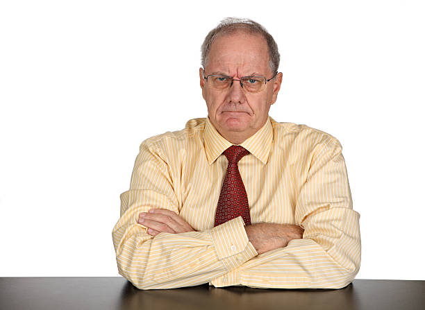 istock Businessman looking angrily at the camera with arms crossed 183408837