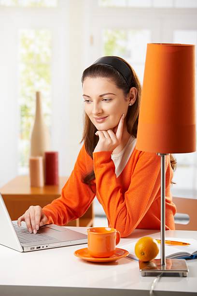 Teenage girl surfing the internet stock photo