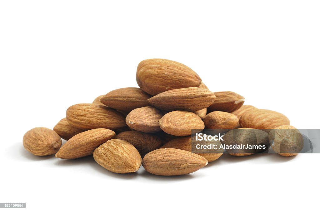 Almonds A pile of Almonds, isolated on a white background. Almond Stock Photo
