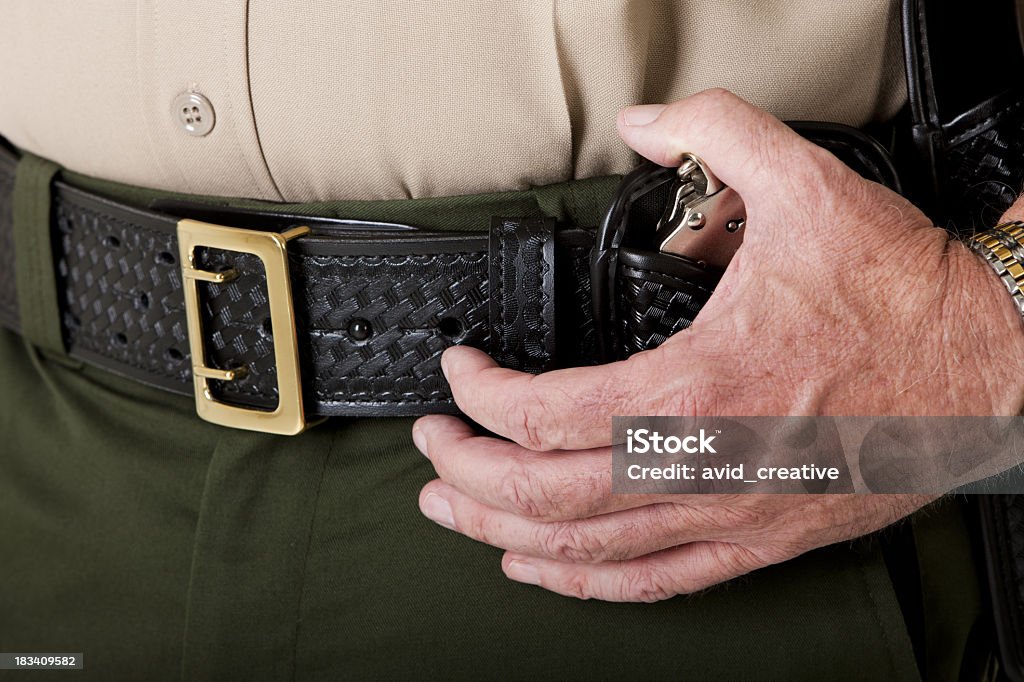 Law Enforcement Closeup Closeup of a police officer's belt. Sheriff Stock Photo