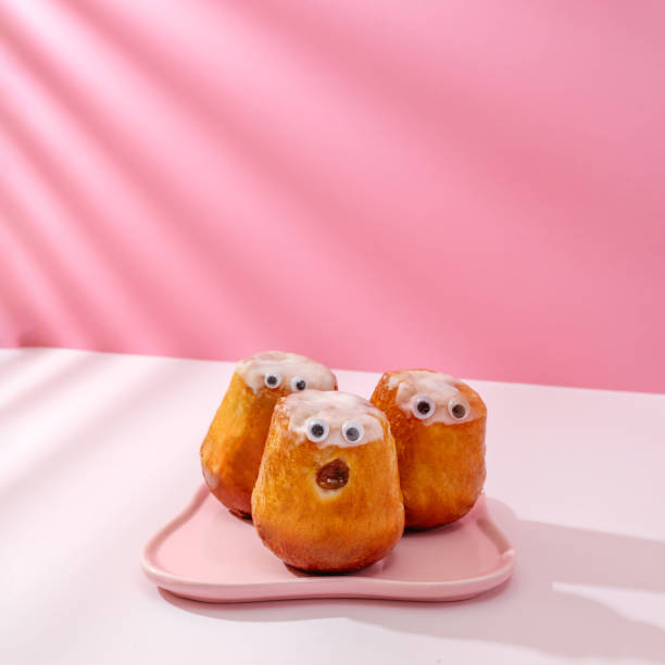 istock three cupcakes with glued eyes on a pink plate 1834096786