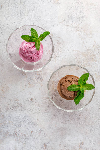 istock chocolate ice cream with mint leaf in a transparent bowl 1834097819