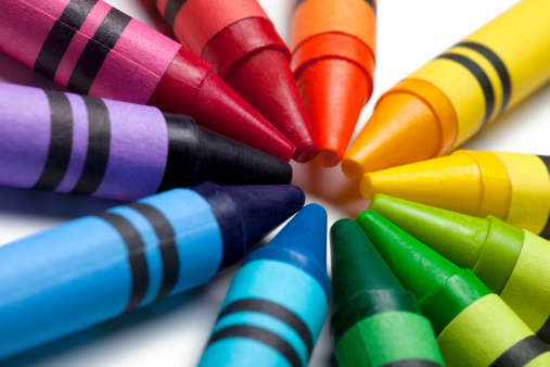 This is a close up photograph of colorful crayon tips pointing towards each other.Click on the links below to view lightboxes.