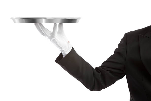 Waiter with an empty tray Waiter holding a tray and looking at the camera formal glove stock pictures, royalty-free photos & images
