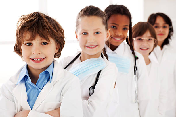 istock Little doctors are smiling. They standing in a row. 183410050