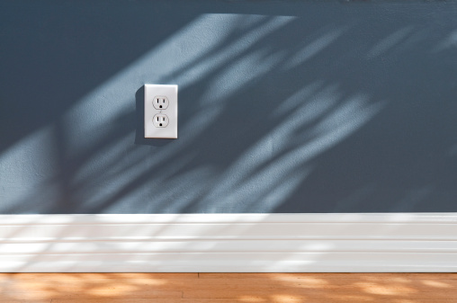 Wall plug in empty room with wood flooring.Take a look at our lightbox's of other related images.
