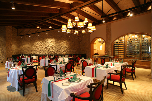 Luxury hotel Italian restaurant and classic chandelier. Indoor decoration. Elegance interior image.