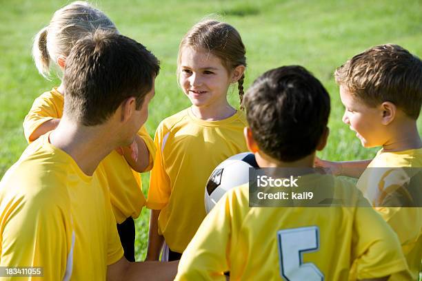 Coach With Young Team Of Soccer Players Stock Photo - Download Image Now - Soccer, Child, Girls