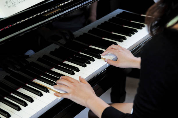 istock Woman playing the piano 1834111085