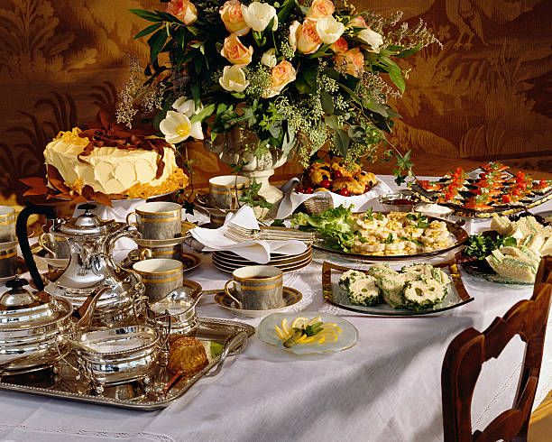 istock Table filled with tea and sandwiches for a party 183411373
