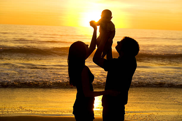 istock Family silhouette at the beach 183411485
