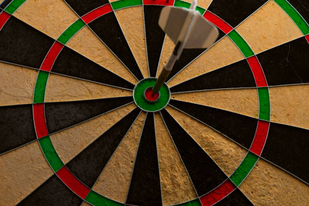istock Bull's eye, dart in the center. View from below 1834115260