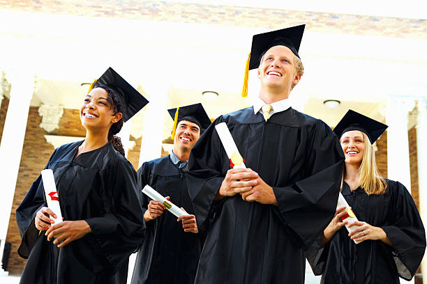 istock Group of graduation students with certificates 183412090