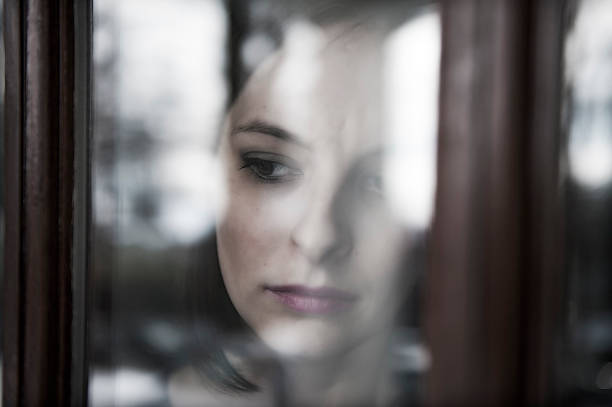 istock Reflections of Sad and Wistful Girl 183412235