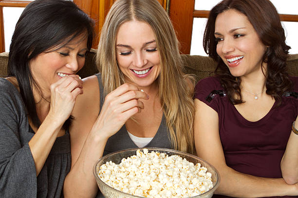istock Diverse group of friends eating popcorn 183412333