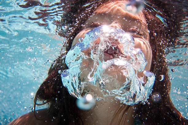 istock Underwater Young Girl Swimming 183412871