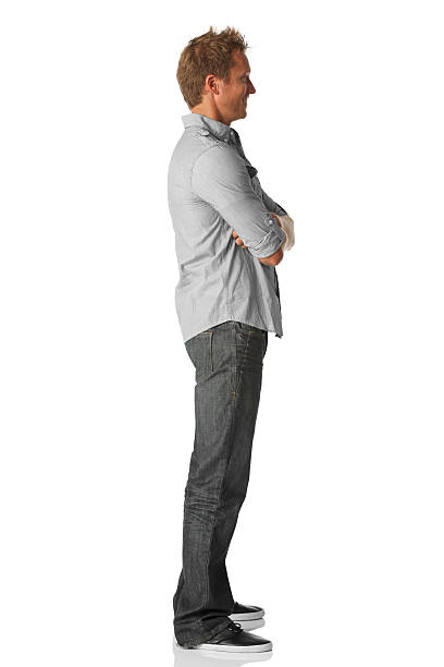 istock Profile of a man standing with arms crossed 183412919