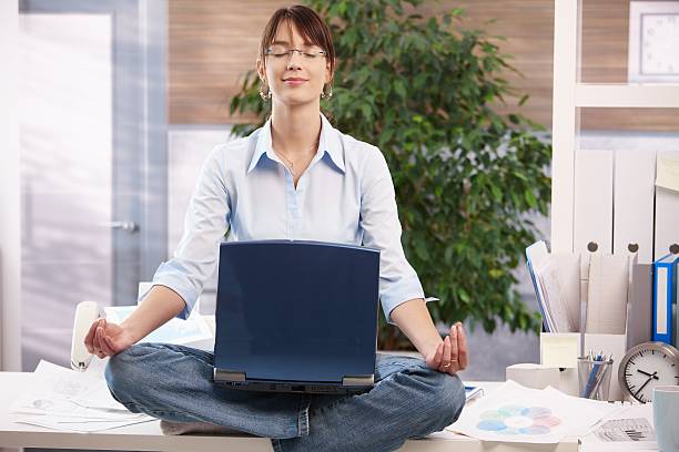 Meditation with laptop stock photo