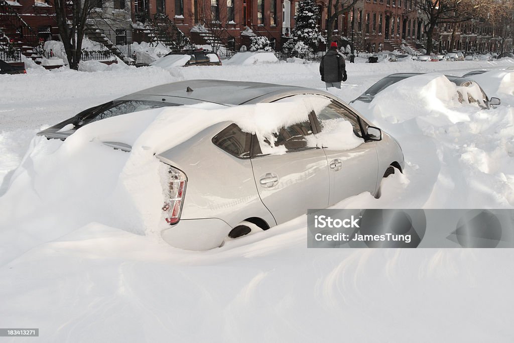 car stuck in snowdrift A car stuck in snowdrift after the blizzard of 2010 in New York City. Stuck Stock Photo