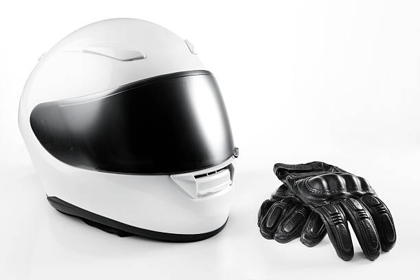 motorcycle helmet and gloves on white background.