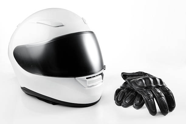White Motorcycle Helmet and Leather Gloves stock photo