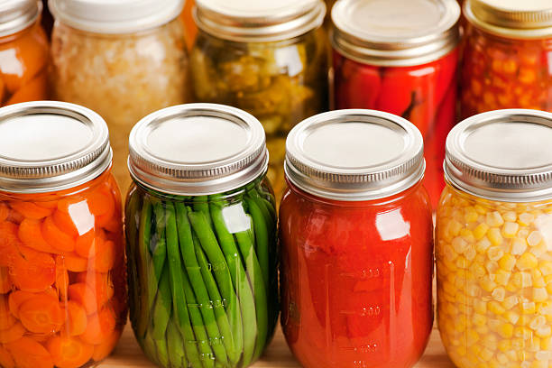 istock Several jars of harvest vegetables in rows 183413456