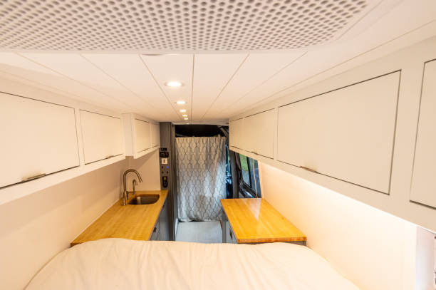 istock Looking toward the kitchen of a converted sprinter van camper 1834141047
