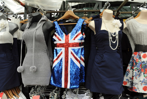 Dresses (one with a sequined British Flag) on display for sale in London