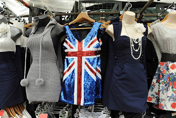 British Fashions Dresses (one with a sequined British Flag) on display for sale in London camden market stock pictures, royalty-free photos & images