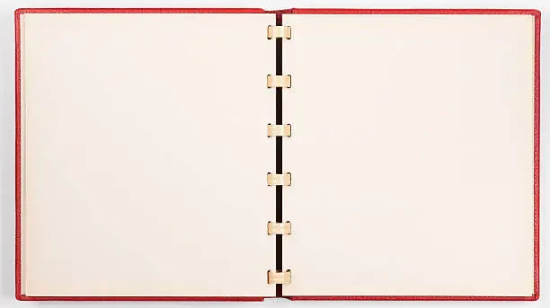 "Old unfolded photo album with blank pages, isolated on white paper background. Album covered by red leather. Clipping path included.See also:"