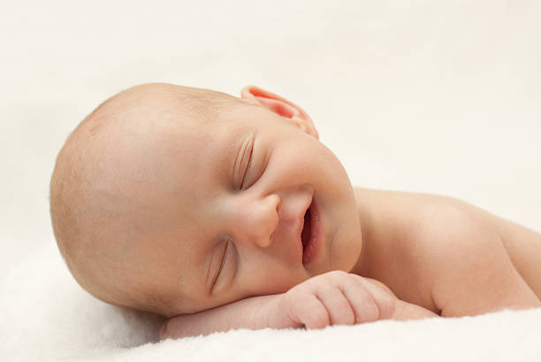 istock Adorable Newborn Baby Sleeping 183415636