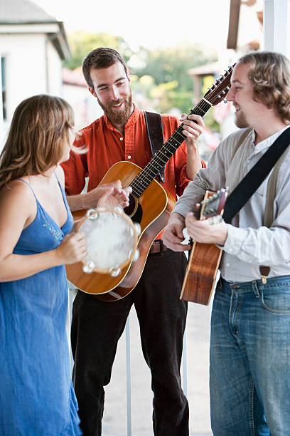 istock Musicians playing guitars and tambourine 183416021