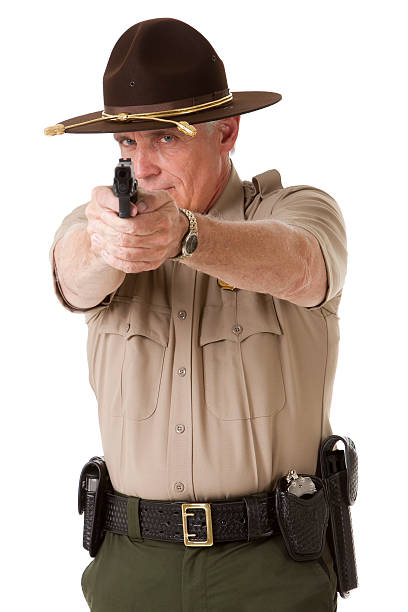 istock Police Officer Pointing Gun 183416217
