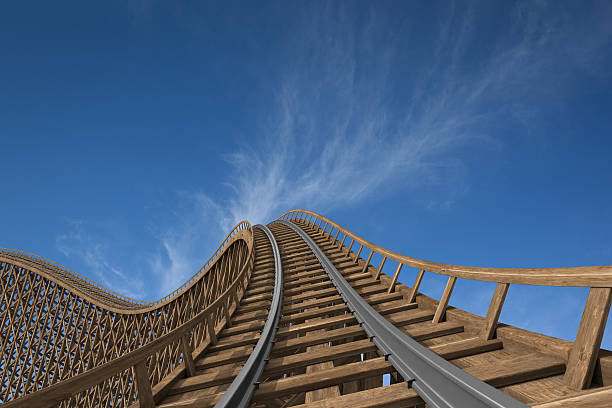 roller coaster Wooden roller coaster track with blue sky in the background. rollercoaster photos stock pictures, royalty-free photos & images