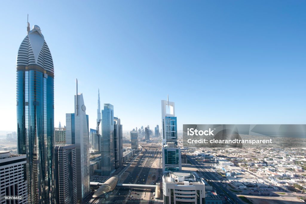 Dubai Winter morning "Centrally in the distance you can see the worlds tallest building, the Burj Khalifa, bottom right Shk Zayed Rd, with a new monorail station and on the far right is Satwa and Jumeirah Beach.Please see some more Dubai at night images from my portfolio:" Aerial View Stock Photo