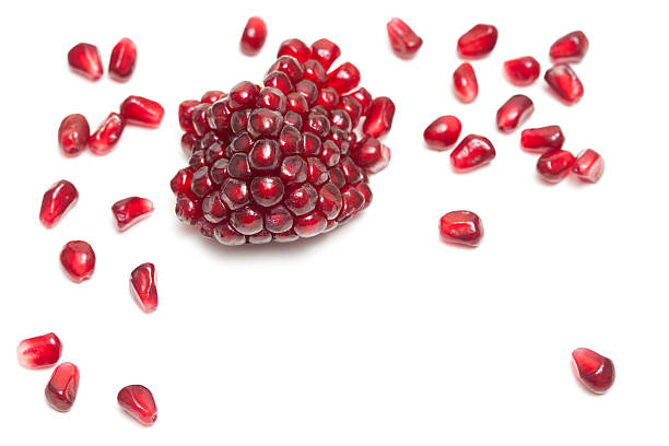 Cluster of Ripe Red Pomegranate Fruit With Seeds stock photo