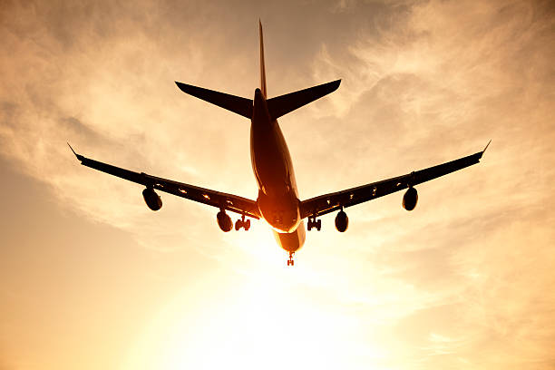 istock Airplane Flying Towards the Sun 183418078