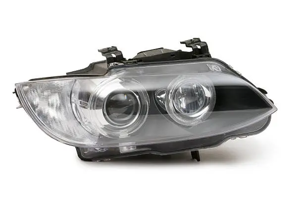 "A Headlight from a car, isolated on white.  Clipping Path on object."