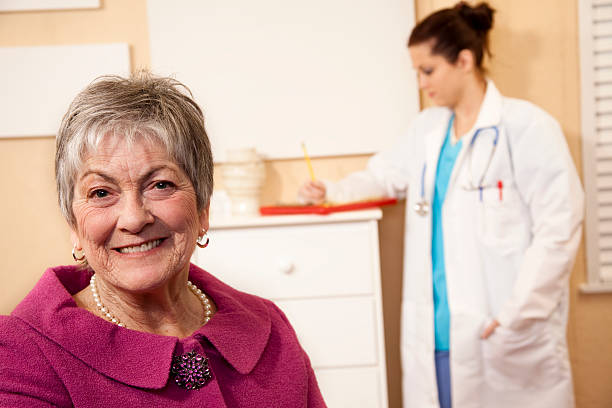 istock Senior woman foreground in doctor's office 183418712
