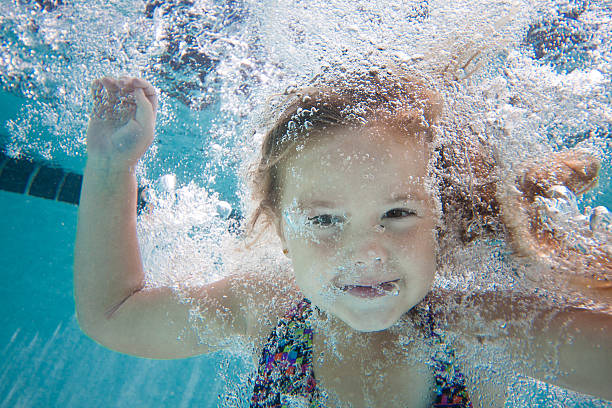 istock Underwater Young Girl Swimming 183419160