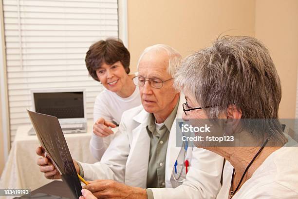 Senior Woman With Family And Doctor Stock Photo - Download Image Now - 60-69 Years, Active Seniors, Adult