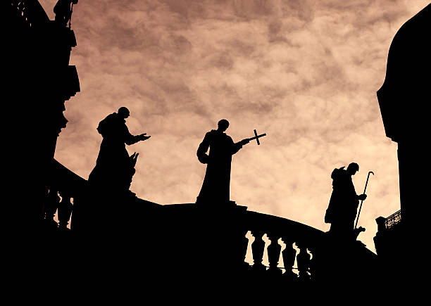istock Silhouette of Priest Statues on a church 183419341