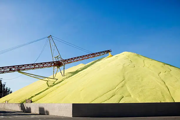 Photo of Massive mound of industrial sulfur at worksite