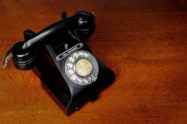 istock Old Black Telephone On Polished Wooden Desk 183419955