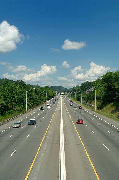 istock Six Lane Highway with Mid-day Traffic 183420142