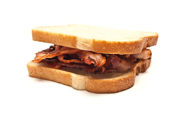 istock Sandwich of bacon strips between two slices of white bread 183420396